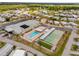 Aerial view of a retirement community featuring a swimming pool, shuffleboard, and clubhouse at 4314 12Th Street E Ct, Ellenton, FL 34222