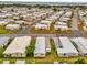 Mobile home community aerial view with well-maintained landscaping and mature trees at 4314 12Th Street E Ct, Ellenton, FL 34222