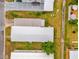 Overhead view of mobile homes, featuring lanai, carport, and green lawns at 4314 12Th Street E Ct, Ellenton, FL 34222