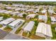 Mobile home community aerial view with well-maintained landscaping and mature trees at 4314 12Th Street E Ct, Ellenton, FL 34222