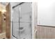 Bathroom featuring a shower stall with sliding glass doors and neutral colored walls at 4314 12Th Street E Ct, Ellenton, FL 34222