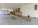 Covered carport and ramp with wooden railing for accessible entry into the home at 4314 12Th Street E Ct, Ellenton, FL 34222