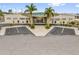 Community clubhouse features palm trees, and plenty of parking at 4314 12Th Street E Ct, Ellenton, FL 34222