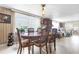 Inviting dining room with a large window and seamless laminate flooring at 4314 12Th Street E Ct, Ellenton, FL 34222