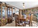 Open dining area showcasing a classic chandelier and views into the kitchen at 4314 12Th Street E Ct, Ellenton, FL 34222