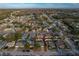 Aerial view of home in established neighborhood, featuring mature trees at 5036 Glenhurst Ln, New Port Richey, FL 34653