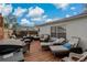 Relaxing outdoor deck with wicker seating, lounge chairs, and a grill for entertaining guests at 5036 Glenhurst Ln, New Port Richey, FL 34653
