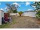 Spacious backyard with wood fence, privacy, and mature landscaping at 5036 Glenhurst Ln, New Port Richey, FL 34653