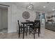 Eat-in dining area features a modern chandelier, neutral paint and views of the living room at 5036 Glenhurst Ln, New Port Richey, FL 34653