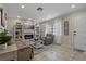 Cozy living room featuring a decorative fireplace, built-in shelves, and a comfortable seating area at 5036 Glenhurst Ln, New Port Richey, FL 34653