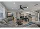 Spacious open-concept living room with a modern kitchen, dining area, and comfortable seating at 5036 Glenhurst Ln, New Port Richey, FL 34653