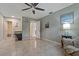Spacious living room with tile floors, neutral paint, and multiple entry points at 5036 Glenhurst Ln, New Port Richey, FL 34653