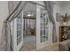 Enclosed patio area with neutral paint, french doors, and ample natural light at 5036 Glenhurst Ln, New Port Richey, FL 34653