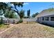Backyard featuring manicured lawn, garden beds, a charming patio area and privacy fencing at 5081 72Nd N Ave, Pinellas Park, FL 33781