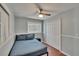 Comfortable bedroom with wood laminate floors, ceiling fan and closet storage at 5081 72Nd N Ave, Pinellas Park, FL 33781