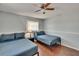 Bedroom featuring hardwood floors, two beds, a ceiling fan, and a nightstand at 5081 72Nd N Ave, Pinellas Park, FL 33781