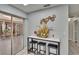 Dining area featuring a flower arrangement on a marble table with stools and decorative wall plates at 5081 72Nd N Ave, Pinellas Park, FL 33781
