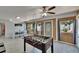 Game room featuring tile floors, foosball table, wood paneled walls, and dining area at 5081 72Nd N Ave, Pinellas Park, FL 33781