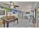Open game room showcases foosball table, dining area, mural, and access to outdoor space at 5081 72Nd N Ave, Pinellas Park, FL 33781