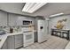 Well-equipped kitchen with gray cabinetry, white appliances, and spacious layout at 5081 72Nd N Ave, Pinellas Park, FL 33781