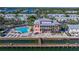 Aerial view of beautiful home with swimming pool, dock, and ocean views from the water at 5191 Salmon Se Dr # C, St Petersburg, FL 33705