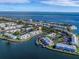 Aerial view of waterfront condominiums with boat docks along a canal leading to the ocean at 5191 Salmon Se Dr # C, St Petersburg, FL 33705