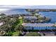 Aerial view of waterfront condo buildings with docks, canals, lush landscaping and scenic bay views at 5191 Salmon Se Dr # C, St Petersburg, FL 33705