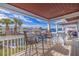 Water view from the balcony with table, chairs, and tropical landscaping at 5191 Salmon Se Dr # C, St Petersburg, FL 33705