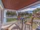 Balcony view overlooking lush green space and tropical landscaping at 5191 Salmon Se Dr # C, St Petersburg, FL 33705