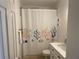Clean bathroom with a shower featuring a decorative curtain and a modern vanity at 5191 Salmon Se Dr # C, St Petersburg, FL 33705