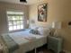 Comfortable bedroom with a window view and side tables at 5191 Salmon Se Dr # C, St Petersburg, FL 33705
