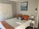 Cozy bedroom with a comfortable bed and a nautical-themed decor at 5191 Salmon Se Dr # C, St Petersburg, FL 33705