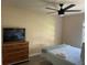 Relaxing bedroom with a TV and neutral tones, creating a serene atmosphere at 5191 Salmon Se Dr # C, St Petersburg, FL 33705