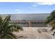 Waterfront view featuring a private wooden dock with ample space for outdoor relaxation and enjoyment by the ocean at 5191 Salmon Se Dr # C, St Petersburg, FL 33705