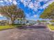 Exterior shot of the apartment complex surrounded by trees and parking at 5191 Salmon Se Dr # C, St Petersburg, FL 33705