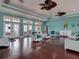 Beautifully decorated lounge with hardwood floors, ceiling fans and waterfront access at 5191 Salmon Se Dr # C, St Petersburg, FL 33705