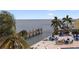 Relaxing waterfront community with palm trees, outdoor seating, swimming pool, and pier access to the beautiful ocean at 5191 Salmon Se Dr # C, St Petersburg, FL 33705
