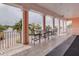 Outdoor patio featuring seating with tables with a view of lush greenery and the street at 5191 Salmon Se Dr # C, St Petersburg, FL 33705