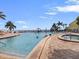 Beautiful community pool with ocean views and brick paver decking with lounge chairs at 5191 Salmon Se Dr # C, St Petersburg, FL 33705