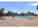 Large swimming pool and deck with lounge chairs surrounded by lush tropical greenery at 5191 Salmon Se Dr # C, St Petersburg, FL 33705
