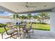 Outdoor patio features a ceiling fan and seating, perfect for enjoying the backyard views at 5235 42Nd S St, St Petersburg, FL 33711