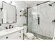 Modern bathroom with sleek fixtures, glass enclosed shower with sleek fixtures, offering spa-like experience at 5235 42Nd S St, St Petersburg, FL 33711