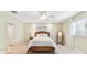 Comfortable bedroom with wood flooring, a ceiling fan, and a window with natural light at 5235 42Nd S St, St Petersburg, FL 33711