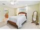Comfortable bedroom with wood flooring, a ceiling fan, and a window with natural light at 5235 42Nd S St, St Petersburg, FL 33711
