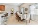 Bright dining area with adjacent breakfast bar features a table set for dinner at 5235 42Nd S St, St Petersburg, FL 33711