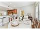 Bright dining area with adjacent breakfast bar features a table set for dinner at 5235 42Nd S St, St Petersburg, FL 33711