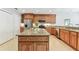 Well-equipped kitchen boasts granite countertops, stainless steel appliances, and a center island with bar seating at 5235 42Nd S St, St Petersburg, FL 33711