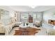 Bright living room features modern tile flooring, ample natural light, and stylish contemporary furnishings at 5235 42Nd S St, St Petersburg, FL 33711