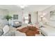 Open-concept living room with tile floors, stylish furnishings, and bright, airy ambiance at 5235 42Nd S St, St Petersburg, FL 33711