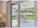 Covered patio with outdoor dining set, perfect for enjoying the backyard view at 5235 42Nd S St, St Petersburg, FL 33711